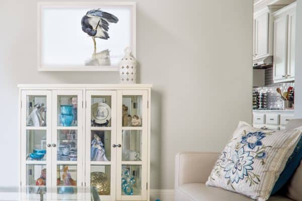 white bird wall art on living room wall