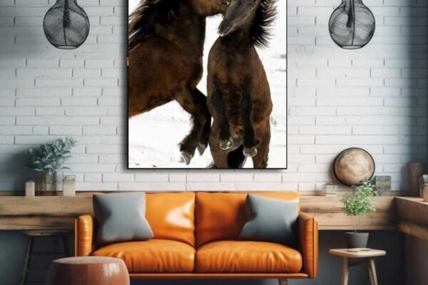 Sophisticated horse photography titled Sculpted Fury, capturing the metallic glow of black horses in motion for a chic minimalist interior.