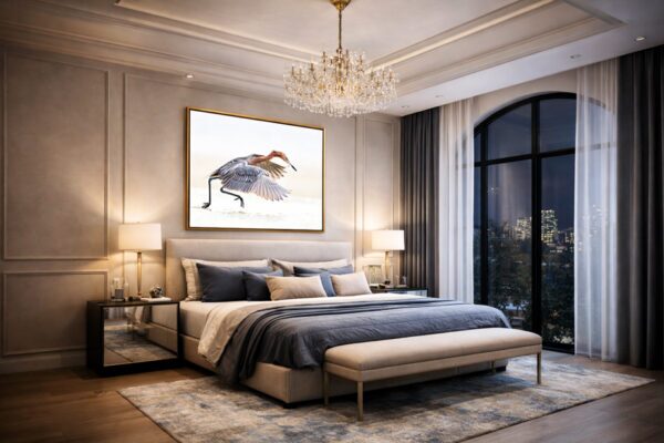 Reddish egret fine art photography displayed above a luxury bed in an elegant bedroom, adding calm movement and refined character to the space